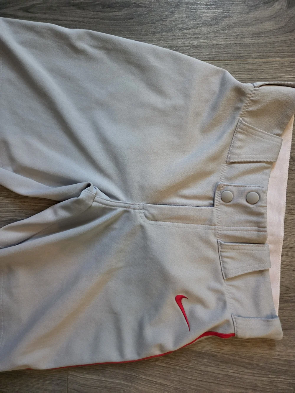 Nike Light Gray Baseball Pants with Red Swoosh Accent